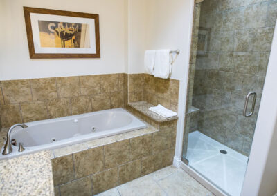 bathroom bathtub and shower with tile at camden on the lake resort